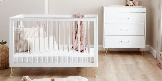 Small nursery with compact 2-piece furniture set in light wood and white