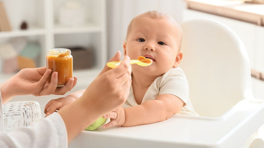 Mum feeding a baby on a highchair with an overlay 7 baby essentials that grow with your baby and save you money.ys every parent should consider before shopping.