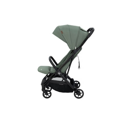 A compact stroller in sage green fabric with a black frame and wheels, shown from a three-quarters angle on a solid white background.
