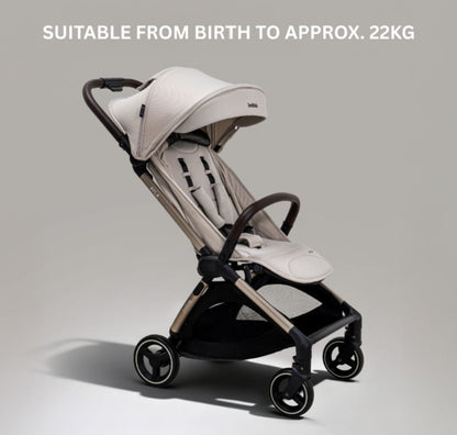 A compact stroller with a light beige canopy and seat, handlebars, and a black frame, shown on a neutral gray background with text at the top reading 'SUITABLE FROM BIRTH TO APPROX. 22KG'.