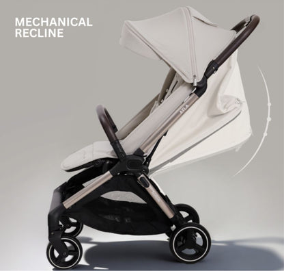 A compact stroller with a light beige canopy and seat, handlebars, and a black frame, shown on a neutral gray background with text at the top reading 'SUITABLE FROM BIRTH TO APPROX. 22KG'.