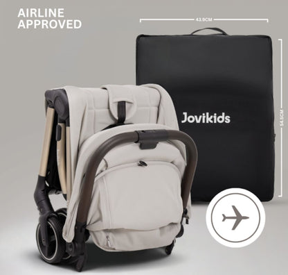 A compact stroller with a light beige canopy and seat, handlebars, and a black frame, shown on a neutral gray background with text at the top reading 'SUITABLE FROM BIRTH TO APPROX. 22KG'.