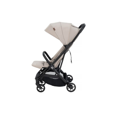 A compact stroller with a light beige (latte) canopy and seat liner, a black frame, and black wheels, shown from a three-quarters angle on a solid white background.