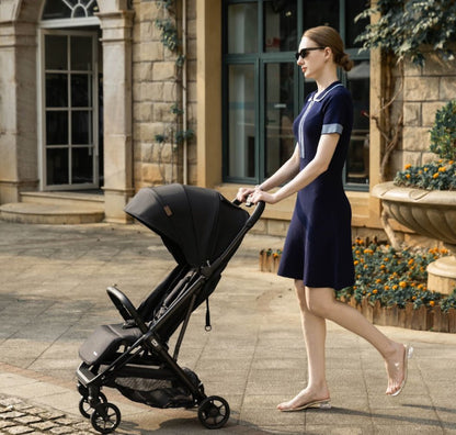 A black stroller with a matching canopy and frame, shown from a three-quarter angle against a plain white background.
