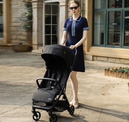 A black stroller with a matching canopy and frame, shown from a three-quarter angle against a plain white background.